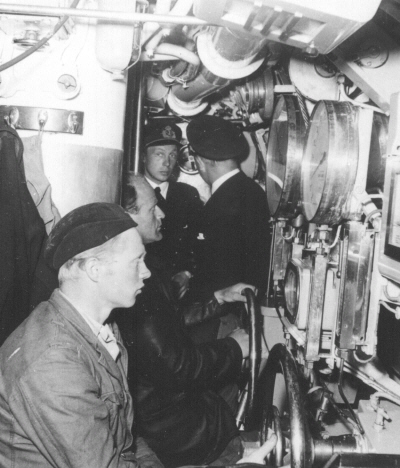 Submarine .U3 Control room port, officers at the diving console corner, in the front helmsman and planesman.