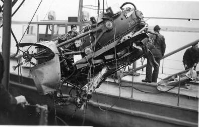 An aircraft engine is salvaged by navy divers 1949.